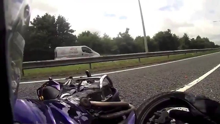 Speeding Motorcycle Get Stuck Between Two Trucks