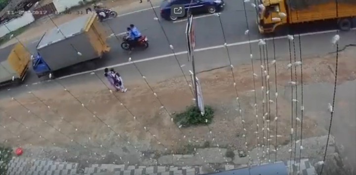 Bike crushed between trucks