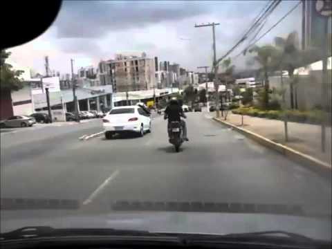 Biker Kicks Car And Falls Over