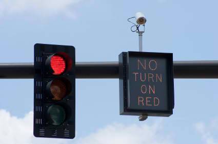 Running red lights at left hand turns